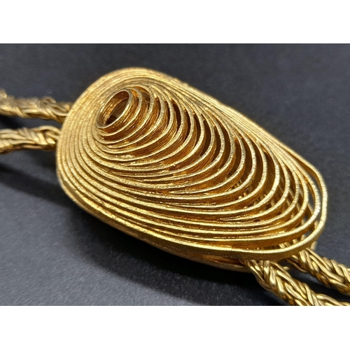 9 - An 18K Yellow Gold Muscle Shell Decorative Chain. 
Main chain with larger shell pendant - two smalle... 