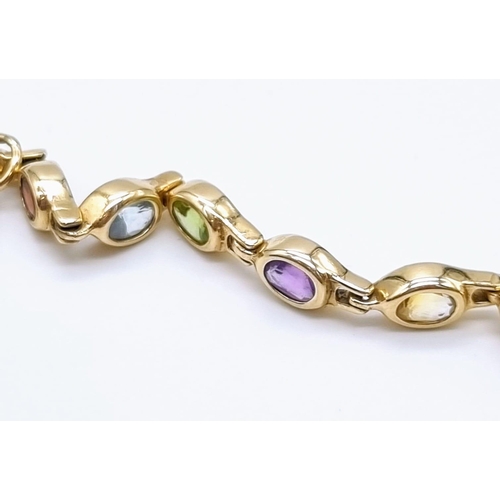 54 - A 14K Yellow Gold Multi-Coloured Gemstone Bracelet. Peridot, amethyst, garnet, citrine and topaz. 20... 