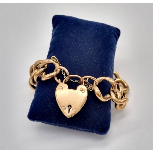 605 - A Vintage 9K Yellow Gold Curb Link Bracelet with Heart Clasp. 18cm. 29.21g