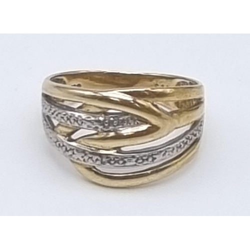 613 - A 9K Yellow and White Gold Intertwining Band Ring. Size O. 3.27g total weight.