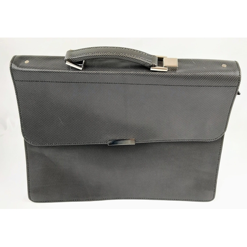 618 - A Simpson of London Silver Carbon Leather Briefcase. 
16 x 13 inches. Unused, but some small signs o... 