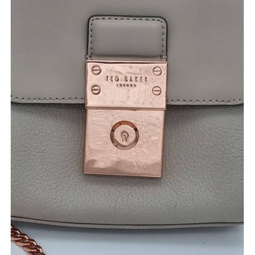 441 - A Ted Baker Leather Handbag. Rose gold plated hardware and strap. Very good condition but please see... 