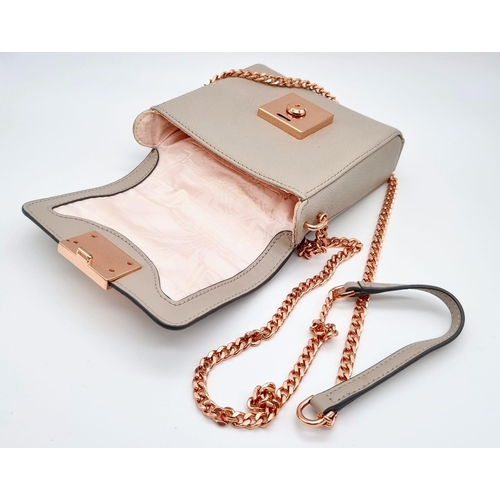 441 - A Ted Baker Leather Handbag. Rose gold plated hardware and strap. Very good condition but please see... 