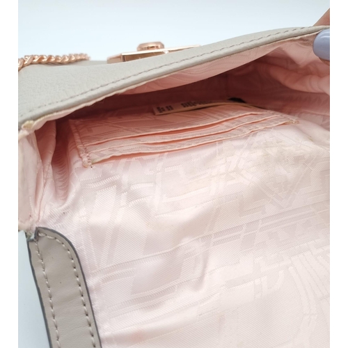 441 - A Ted Baker Leather Handbag. Rose gold plated hardware and strap. Very good condition but please see... 