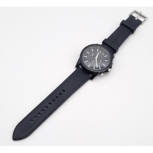 322 - An Armani Exchange Chronograph Gents Watch. Black rubber strap. Case - 44mm. Black dial with three s... 