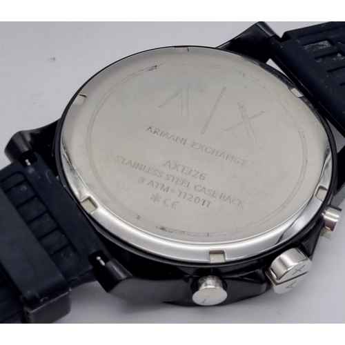 322 - An Armani Exchange Chronograph Gents Watch. Black rubber strap. Case - 44mm. Black dial with three s... 