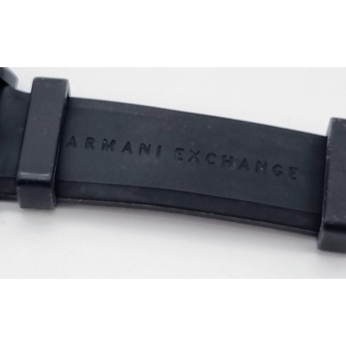 322 - An Armani Exchange Chronograph Gents Watch. Black rubber strap. Case - 44mm. Black dial with three s... 