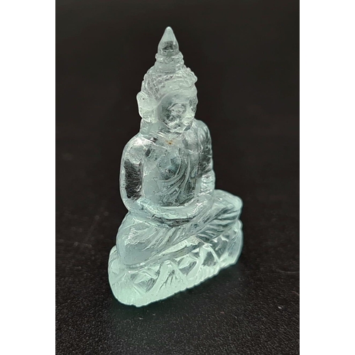 91 - A Carved Natural Aquamarine Buddha Figure. 19.47ct. 28 x 18mm. Anchor gem lab certificate.