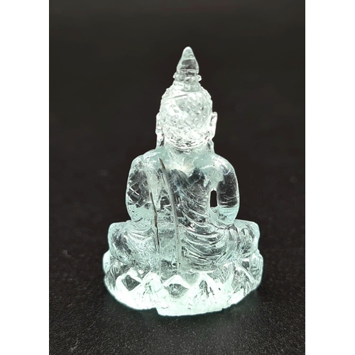 91 - A Carved Natural Aquamarine Buddha Figure. 19.47ct. 28 x 18mm. Anchor gem lab certificate.