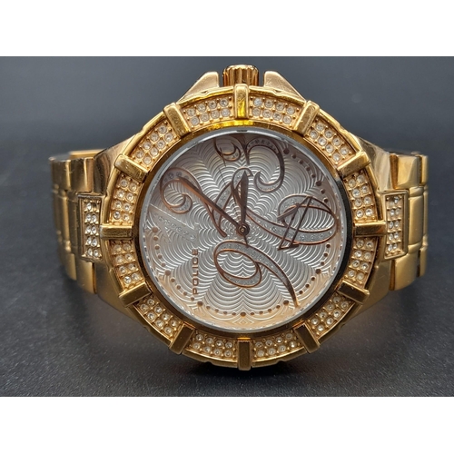 237 - A Police Gold Plated Watch. Gold plated strap and case - 38mm. White stone decorated bezel. White an... 