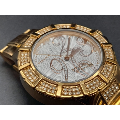 237 - A Police Gold Plated Watch. Gold plated strap and case - 38mm. White stone decorated bezel. White an... 