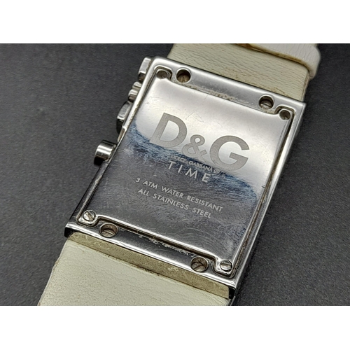 244 - A Dolce and Gabbana Dress Watch. Leather strap. Rectangular case - 40 x 25mm. Two tone dial with whi... 