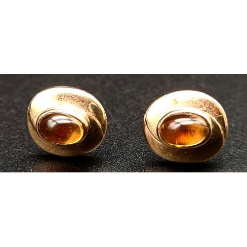 469 - A Pair of 9K Yellow Gold Citrine Stud Earrings and Pendant Set. One of the earrings is missing its b... 