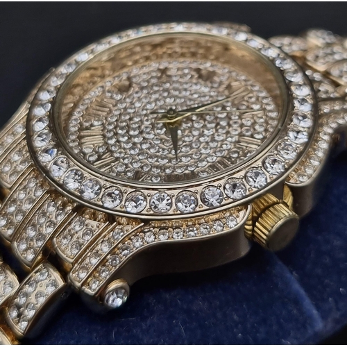 406 - A Techno Bling Watch. Gold plate and white stones throughout. Case - 45mm. In very good condition an... 