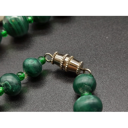 651 - A Vintage Graduated Malachite Bead Necklace. 20mm largest bead. Barrel clasp. 60cm