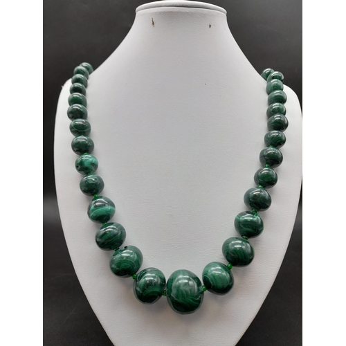 651 - A Vintage Graduated Malachite Bead Necklace. 20mm largest bead. Barrel clasp. 60cm