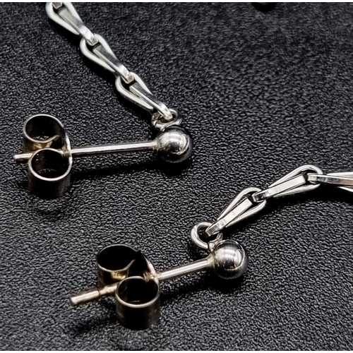 1029 - A pair of sterling silver rhodium plated chain earrings. Total Weight: 2.82 grams. Drop length: 9cm.