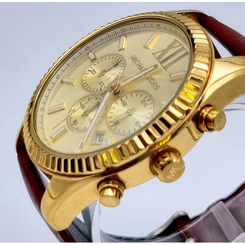 195 - A Michael Kors Chronograph Gents Watch. Brown leather strap. Gilded case - 45mm. Champagne dial with... 