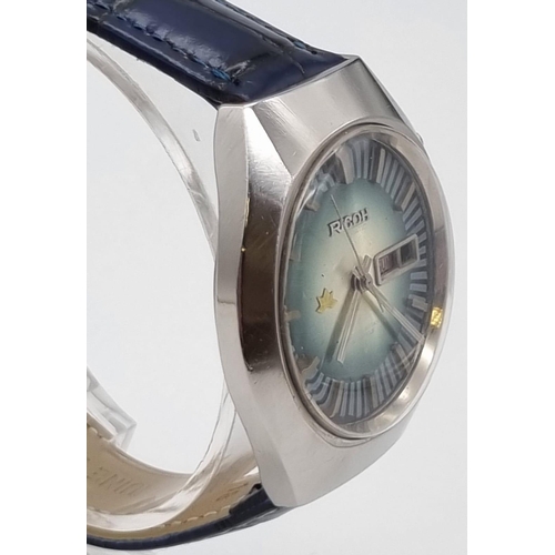 230 - A Rare Vintage Ricoh (Seiko) Gents Watch. Blue leather strap. Stainless steel case - 40mm. Blue dial... 