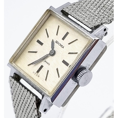 902 - A Vintage Sekonda Quartz Ladies Watch. Stainless steel mesh strap. Square case - 20 x 20mm. In origi... 