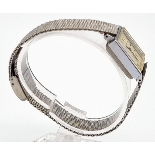 902 - A Vintage Sekonda Quartz Ladies Watch. Stainless steel mesh strap. Square case - 20 x 20mm. In origi... 