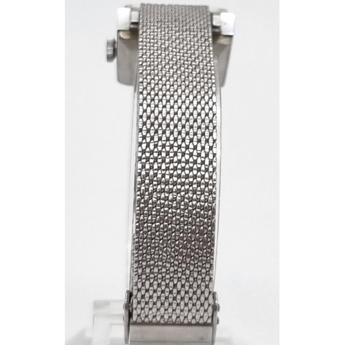 902 - A Vintage Sekonda Quartz Ladies Watch. Stainless steel mesh strap. Square case - 20 x 20mm. In origi... 