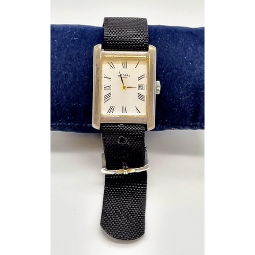 476 - A Vintage Rotary 925 Silver Tank Watch. Black cloth strap. Square silver case - 32 x 25mm. White dia... 