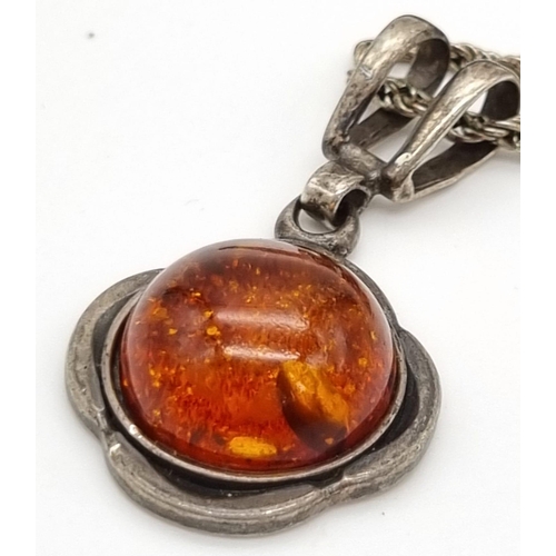 301 - A Vintage Amber Cabochon set in a 925 Silver Pendant -on a vintage necklace. 2 and 46cm.