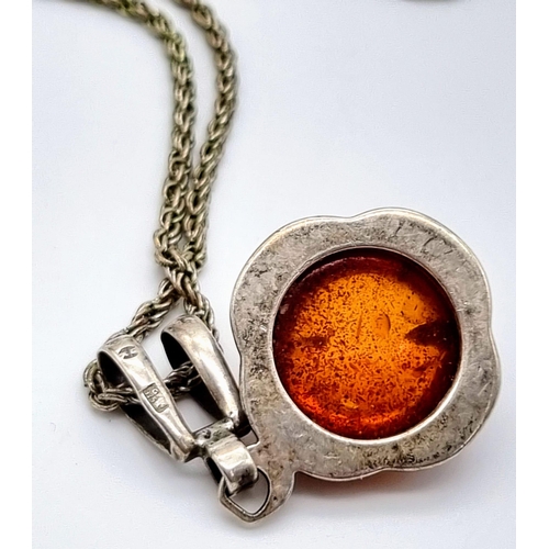 301 - A Vintage Amber Cabochon set in a 925 Silver Pendant -on a vintage necklace. 2 and 46cm.