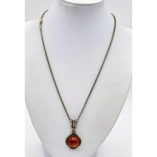 301 - A Vintage Amber Cabochon set in a 925 Silver Pendant -on a vintage necklace. 2 and 46cm.