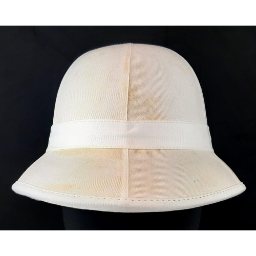 1166 - A Brand New Royal Marines Pith Helmet. No fittings - In bag.