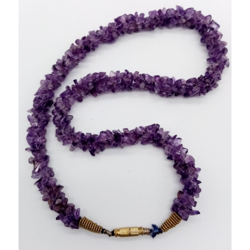 1097 - A Rough Natural Amethyst Necklace. Screw-barrel clasp.
52cm.