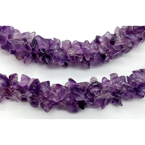 1097 - A Rough Natural Amethyst Necklace. Screw-barrel clasp.
52cm.