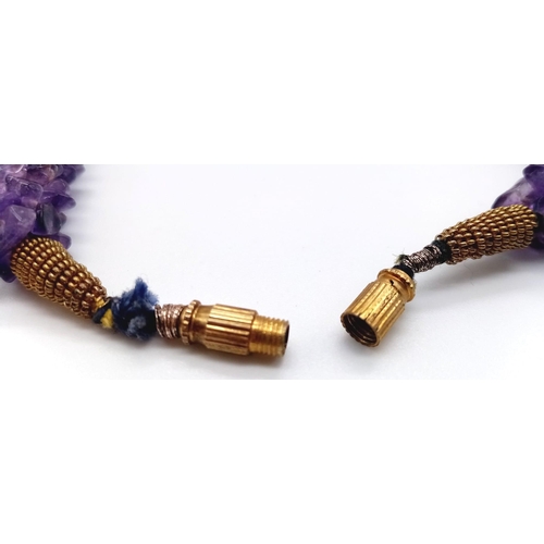 1097 - A Rough Natural Amethyst Necklace. Screw-barrel clasp.
52cm.