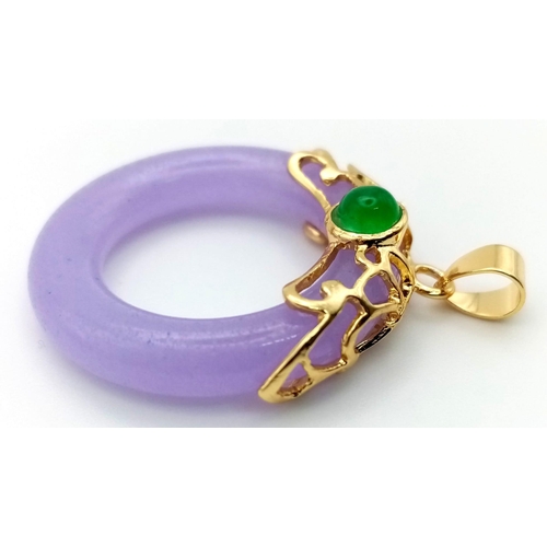 1110 - A Lavender Jade Doughnut Pendant with Gilded Setting. 3cm.