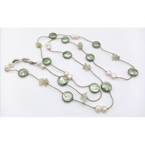 1114 - A Green Coin Pearl and Seed Pearl Opera Necklace.  80cm