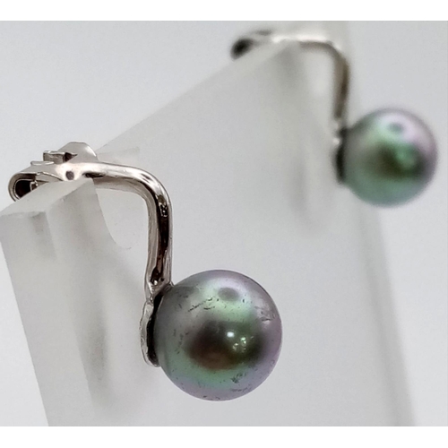 1138 - A Pair of Cultured Pearl Clip On Earrings.