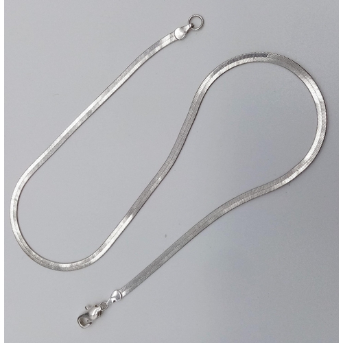 1154 - A Silver Herringbone Choker Necklace. 38cm