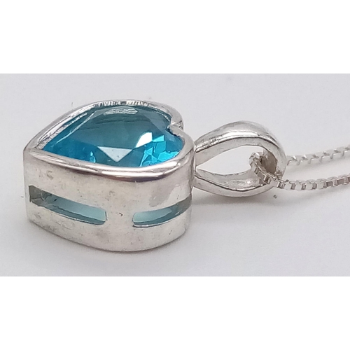 1156 - A Blue Topaz Heart Pendant on a Disappearing Silver Necklace. 10mm and 44cm