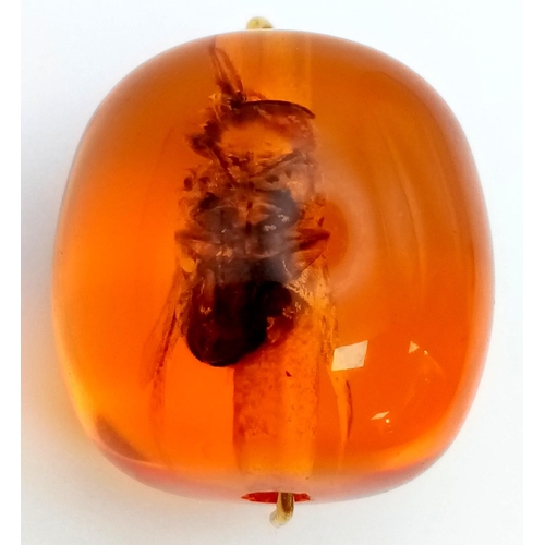 1159 - A Bee in Amber-Coloured Resin Pendant. 2 x 2cm