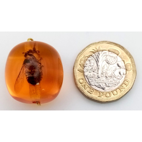 1159 - A Bee in Amber-Coloured Resin Pendant. 2 x 2cm