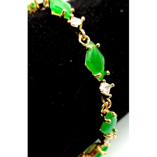 1176 - A Green and White Stone Gilded Bracelet. 19cm