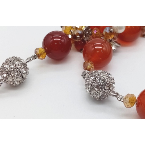 1189 - A Carnelian and Cultured Seed Pearl Necklace and Bracelet Set. Carnelian beads separated by smaller ... 