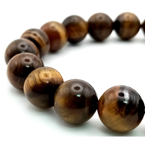 1194 - A Tigers Eye Beaded Expandable Bracelet. Beads 8mm.