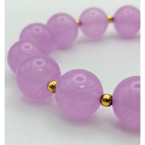 1197 - A Lavender Jade Beaded Bracelet. 12mm.