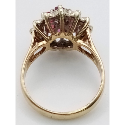 954 - A 9K Yellow Gold Ruby and Diamond Floral Ring. Six rubies and thirteen diamonds. Size N. 4.16g total... 