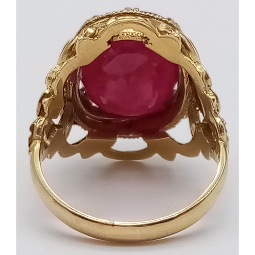 964 - A Hand-Crafted 14K Yellow Gold Large Ruby Ring. Large central faceted oval ruby - 15ct. Size N. 7.46... 