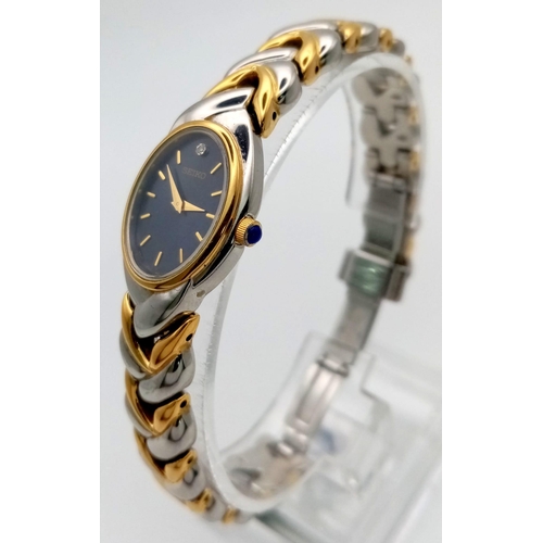 1136 - A Ladies Two Tone Seiko Watch. Case - 20mm. Quartz movement. In good condition and working order,