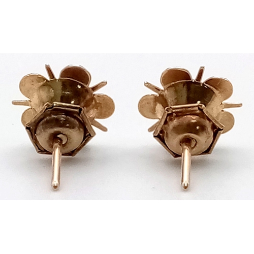 540 - A Pair of Vintage 9K Yellow Gold Red Stone Floral Stud Earrings. 1.25g total weight.