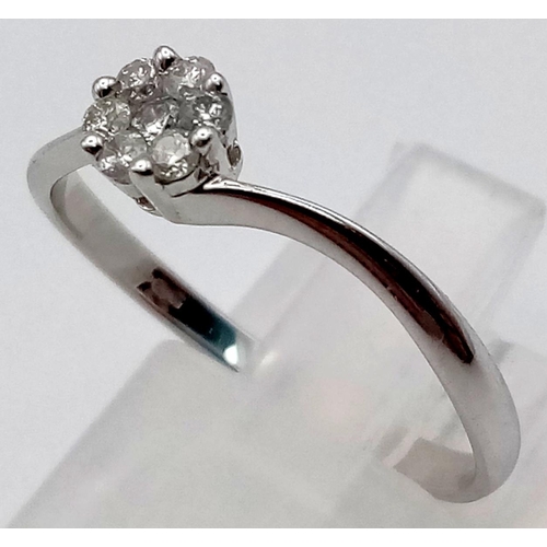 78 - A 9K White Gold Diamond Solitaire Ring. Size Q. 0.15ct.
1.4g total weight.